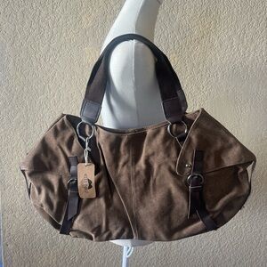 Woman’s brown canvas bag